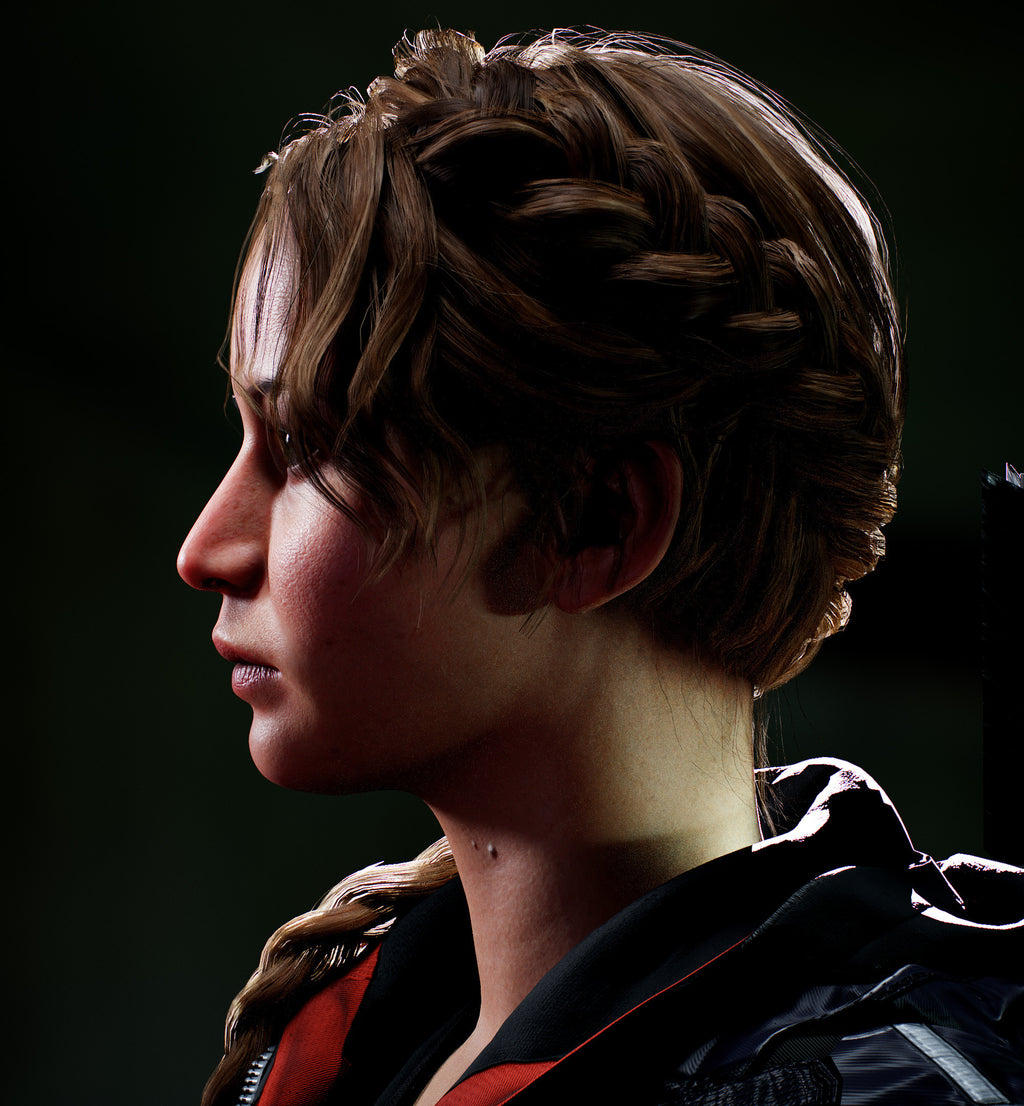 Close-up of a person with braided hair against a dark background